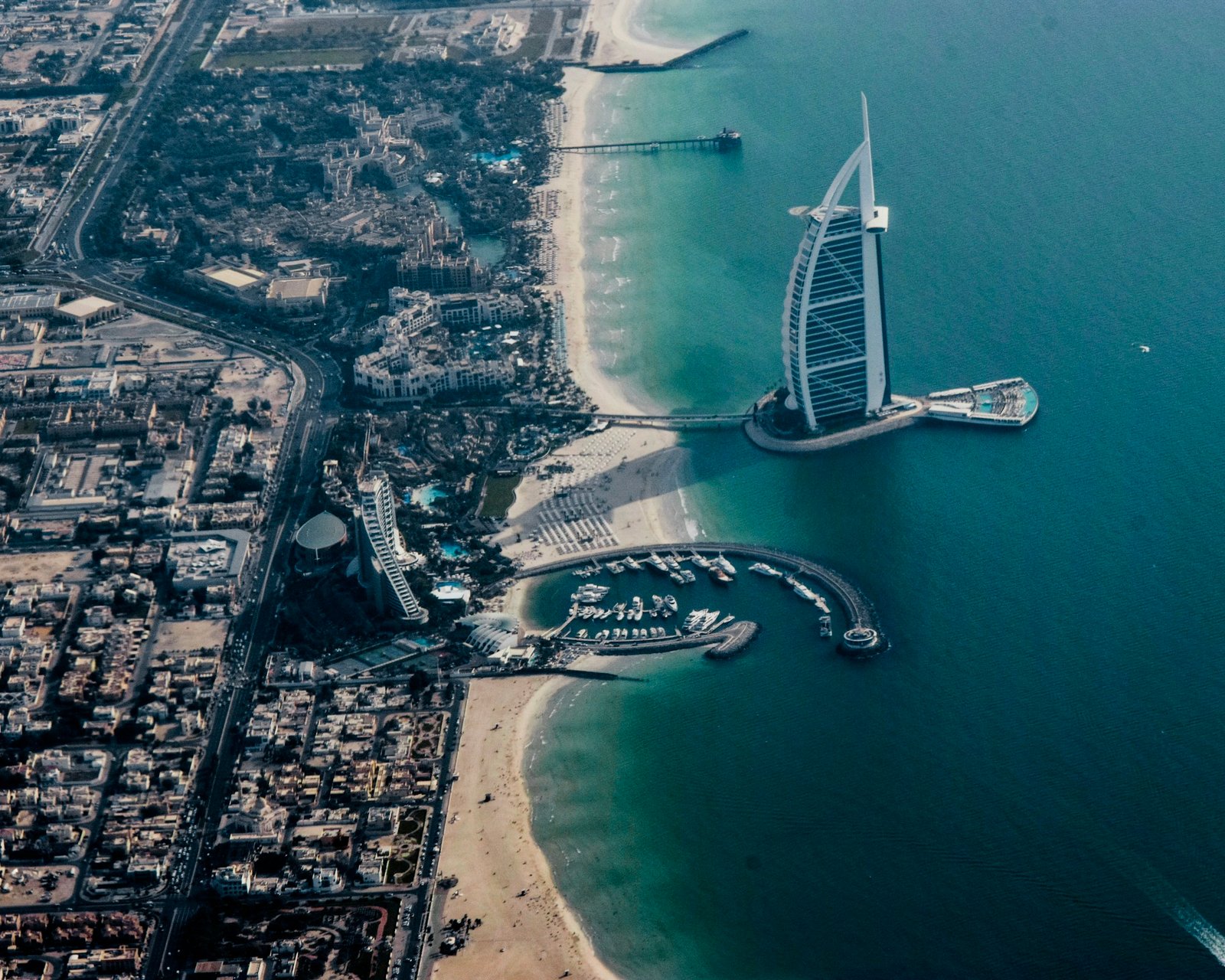 The Burj Al Arab and Dubai's turquoise coastline seen from above