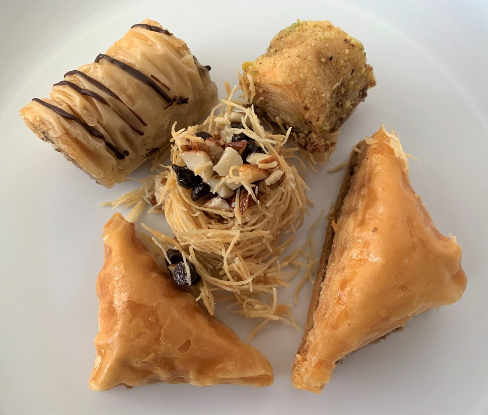 Baklava displayed on a white plate. Photograph by Peter Rimar.